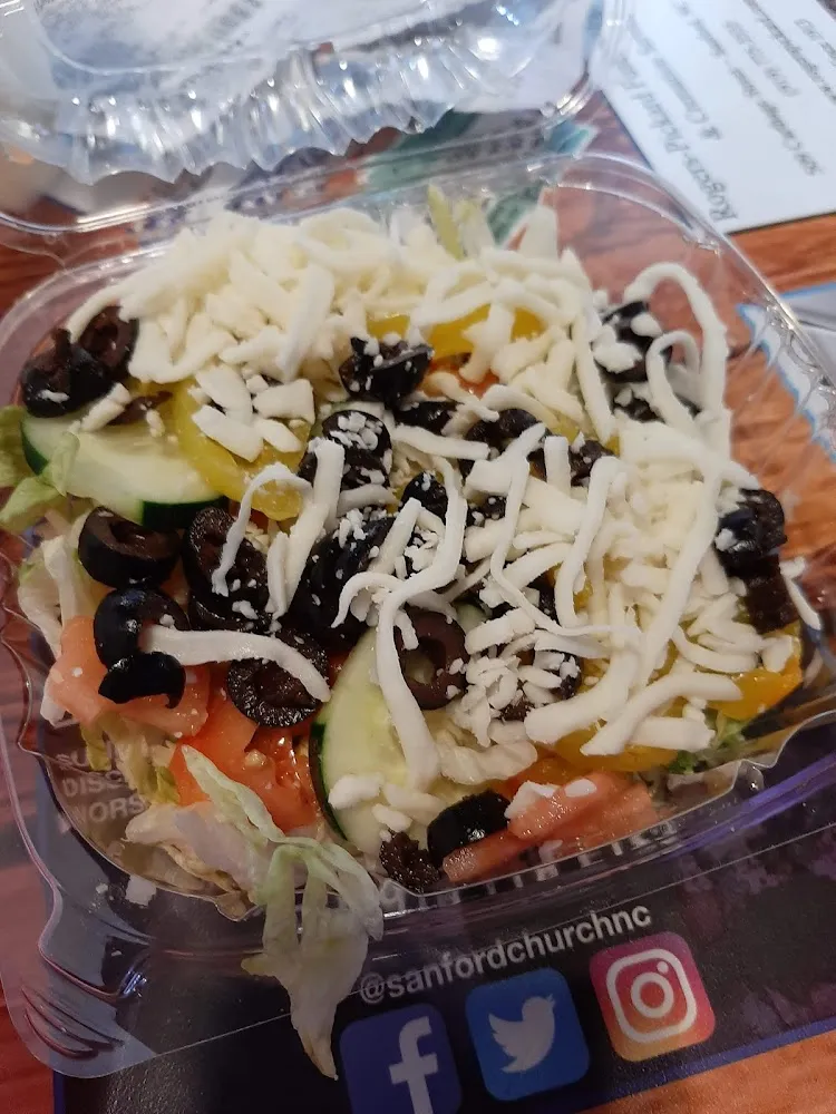 Side Salad with Lettuce Tomatoes Cucumbers Banana Peppers Black Olives and Cheese